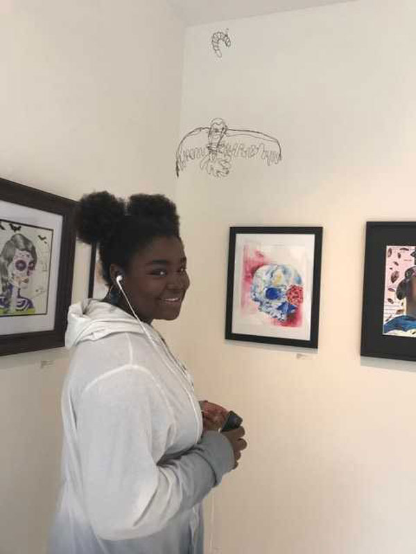 Huntington freshman Evelyn Johnson were her artwork at the Main Street Gallery.