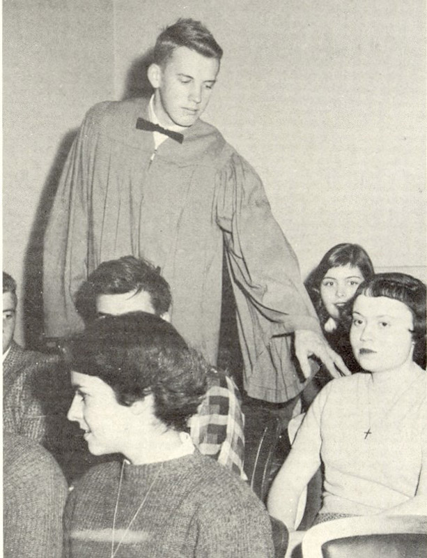 The tapping of a new member during the 1958 National Honor Society induction.