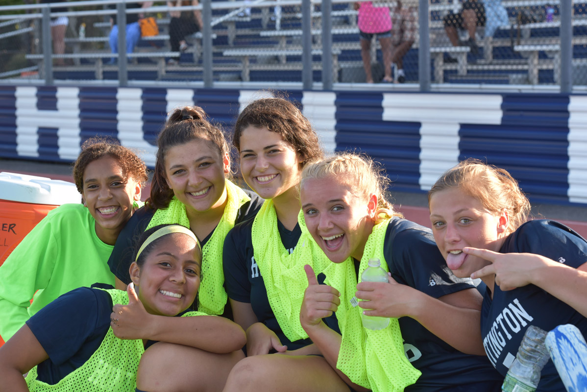 Riva Bergman (third from right) on the sideline with the Huntington soccer team.
