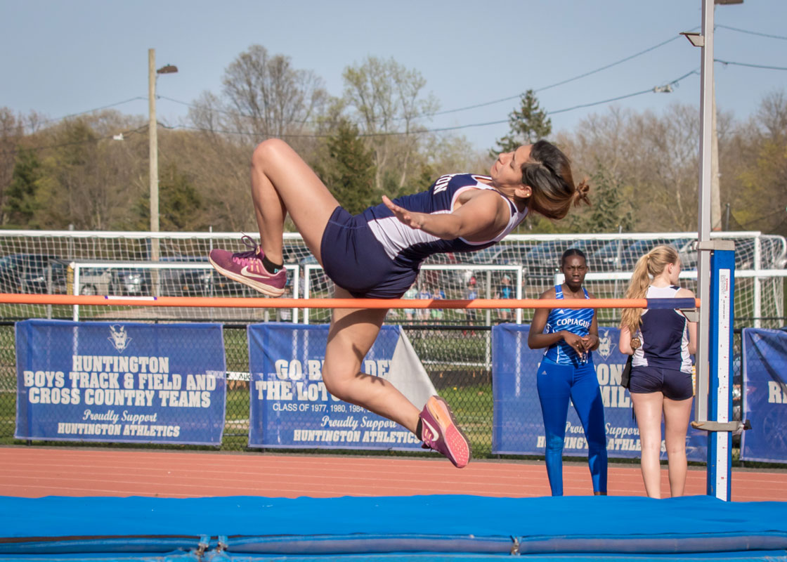 Kiara Rafailan clears the high jump bar for the Blue Devils last spring. (Mike Connell photo.)