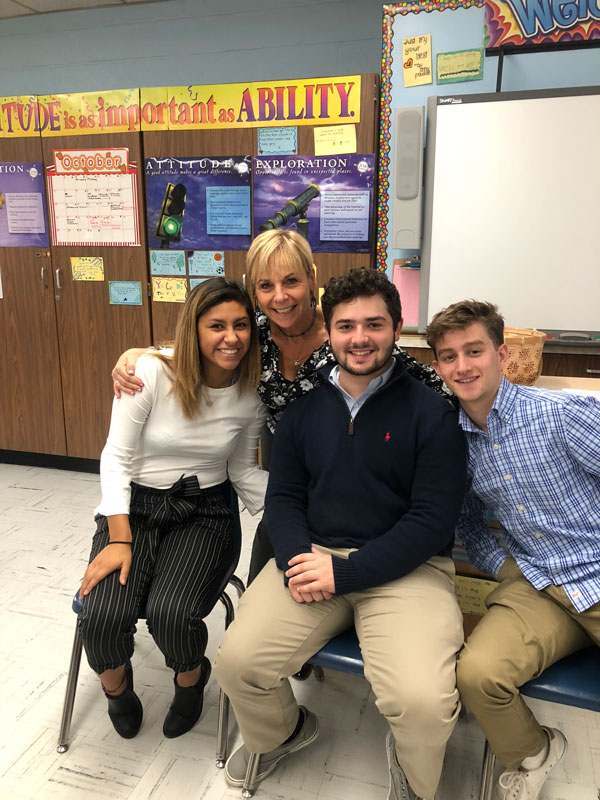 Teacher Suzi Biagi with some of her business students.