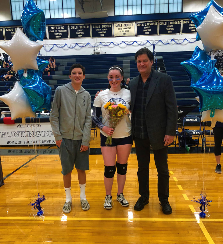 Shaye O'Beirne is surrounded by her brother and father.