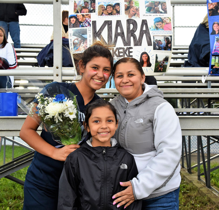 Senior Kiara Rafailan with her mom and sister on Senior Day.