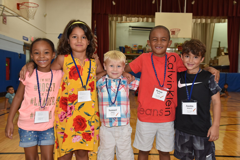 These Washington School first graders were happy to be back with their friends