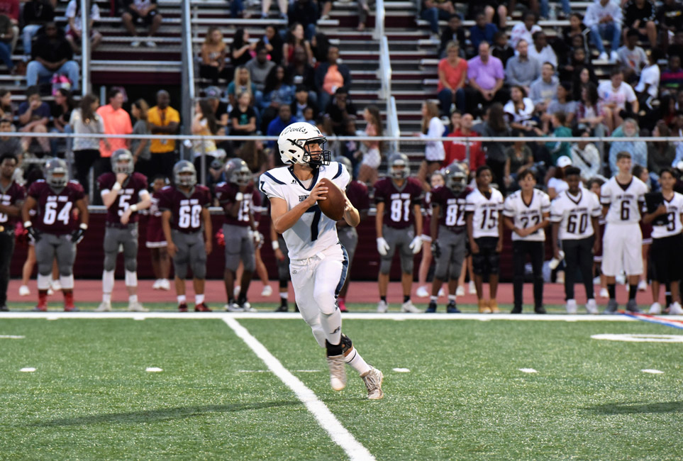 Quarterback JP Paci drops back to pass last Friday night.