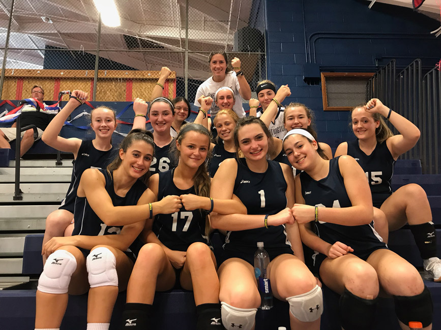Huntington head coach Lauren Visbal and her players display the bracelets they purchased to support Miles Lerner.