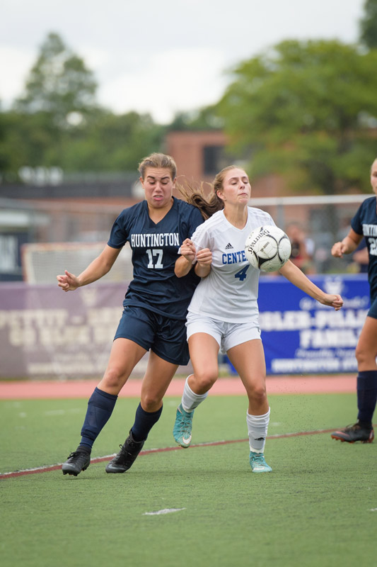 Marissa Stafford (left) mixes it up for the Blue Devils. (Darin Reed photo.)