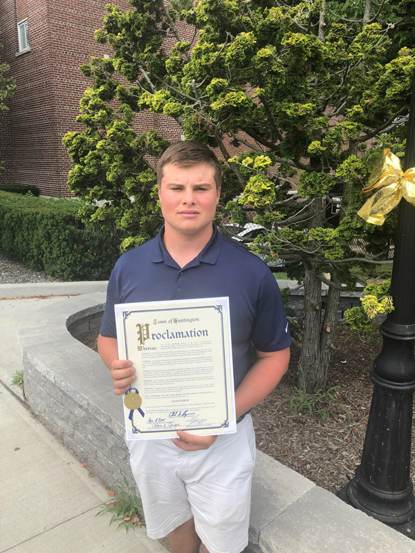 Chas Forte outside Town Hall with a Huntington Town Board proclamation.