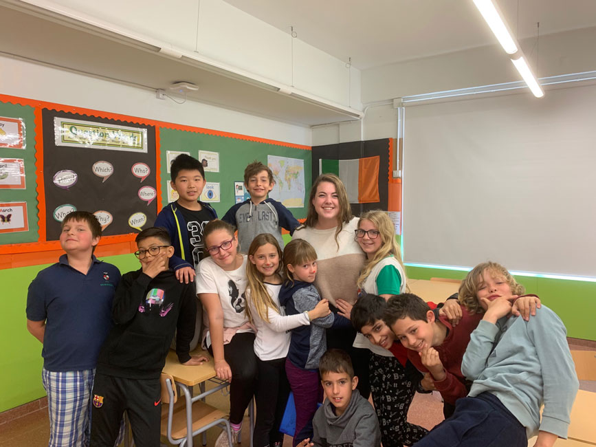 Caroline Maggio with some of the students she has worked with while studying at Quinnipiac University.