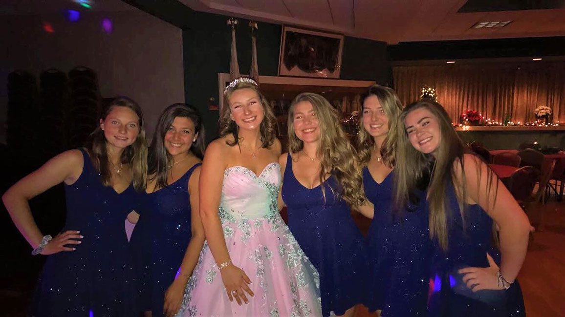 Caroline Hartough (left) and her friends flank Holly Wright at her sweet 16 party.