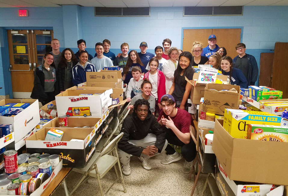 Huntington student government members delivered two busloads of food to the hungry.