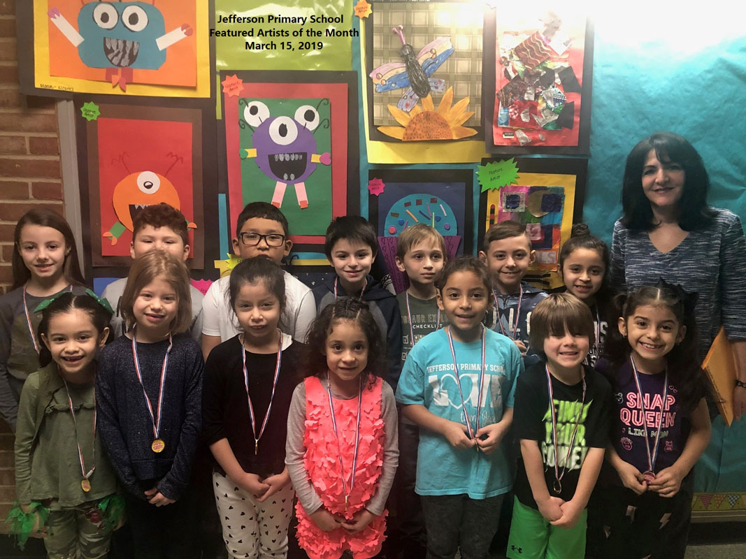 Art teacher Maria Mazzola with Jefferson School's Featured Artists of the Month for March.