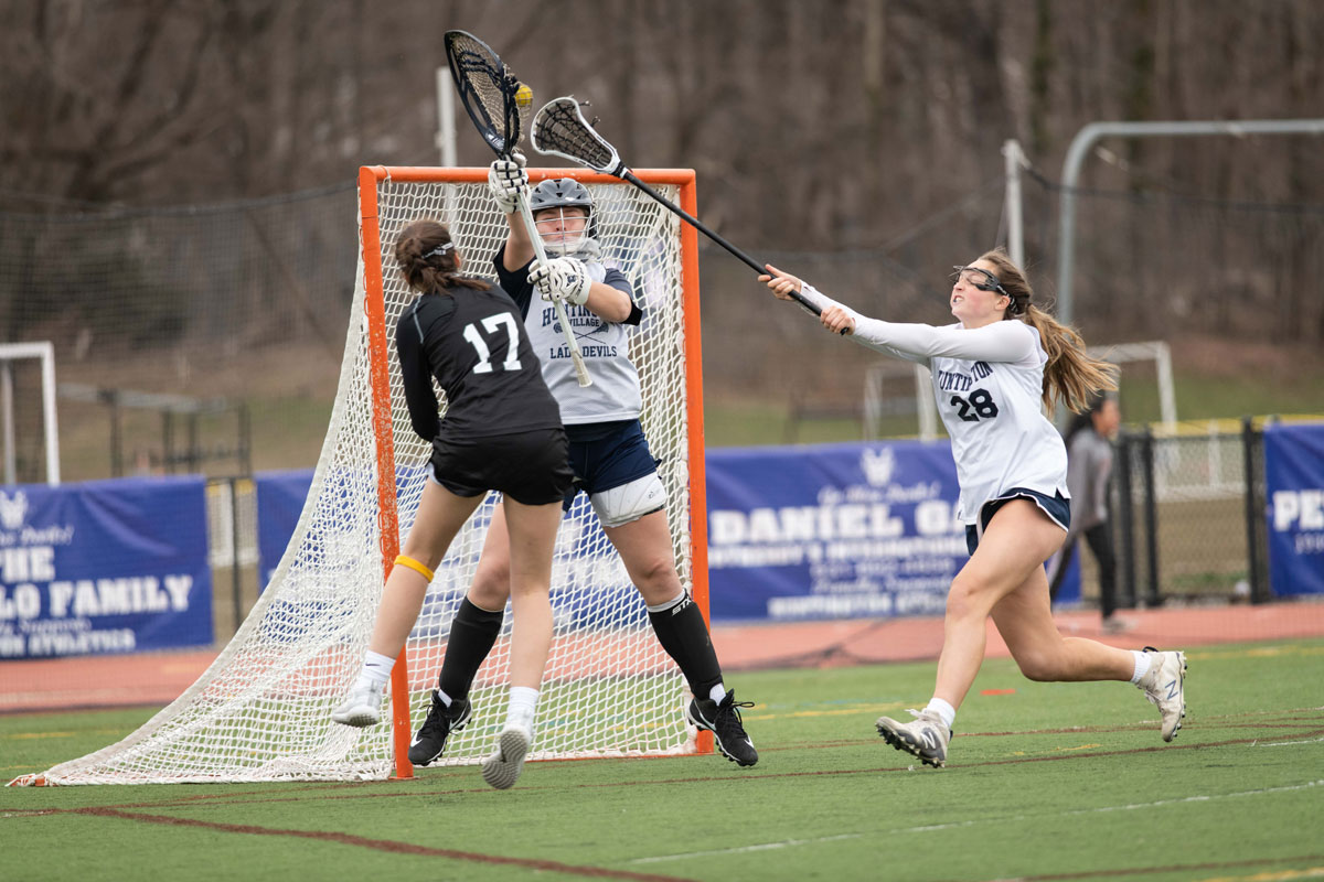 Caroline Hartough (right) plays defense for Huntington. (Darin Reed photo)