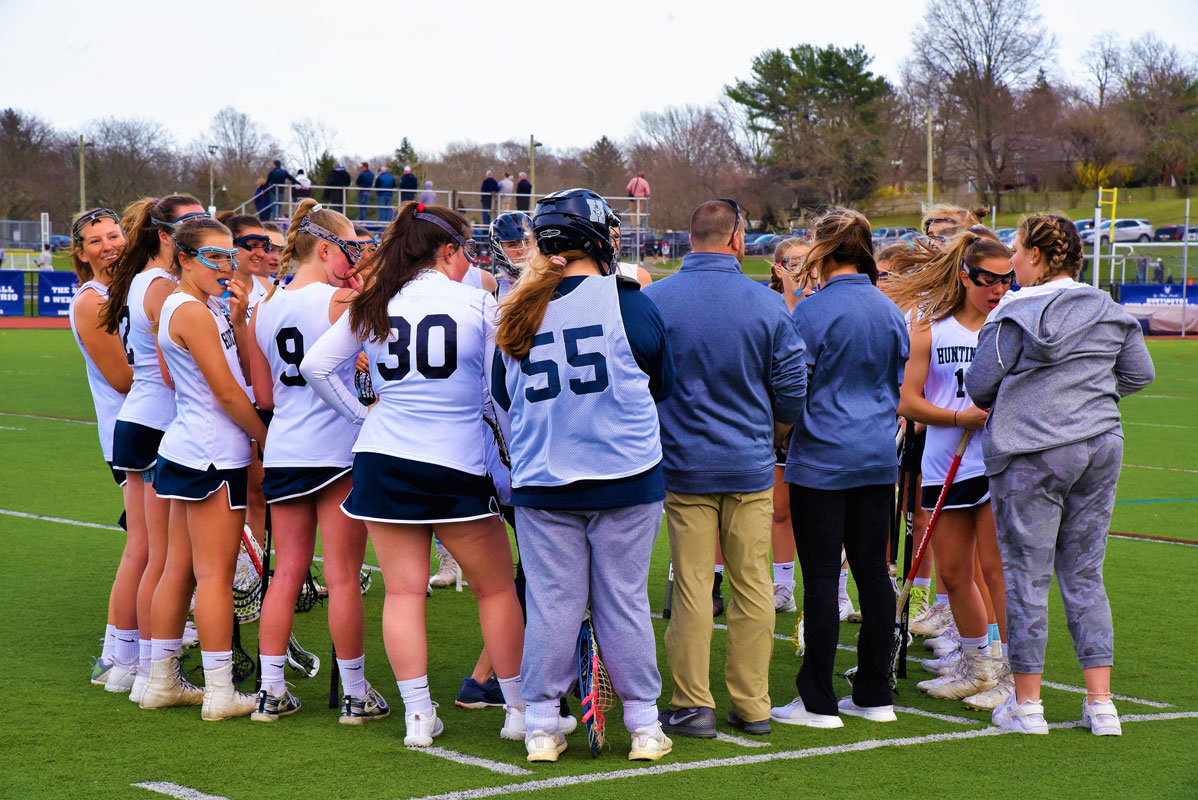The Blue Devils huddled before taking the field to begin the game,