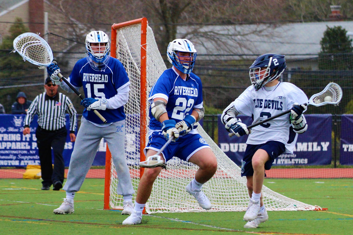 Huntington's Billy Burton (right) closes in on the goal. (Erik Krisch photo.)