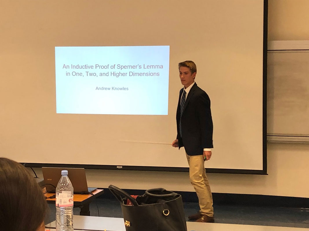 Huntington junior Andrew Knowles presenting his project on Sperner's Lemma at the LI Math Fair.