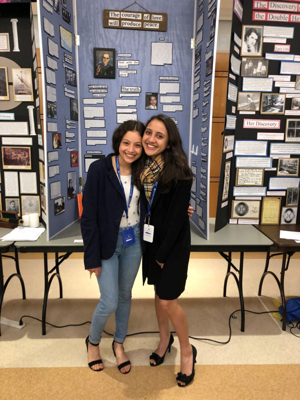 Daniela Ramos (right) with National History Day research partner Daniela Weihskopf Escobar and their project.