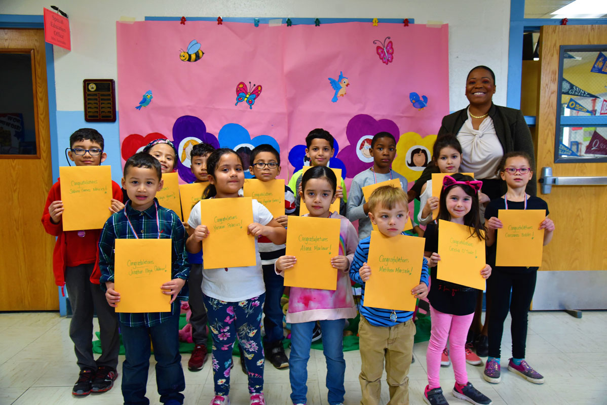 Washington Principal Michelle Richards with April's Featured Artists of the Month 