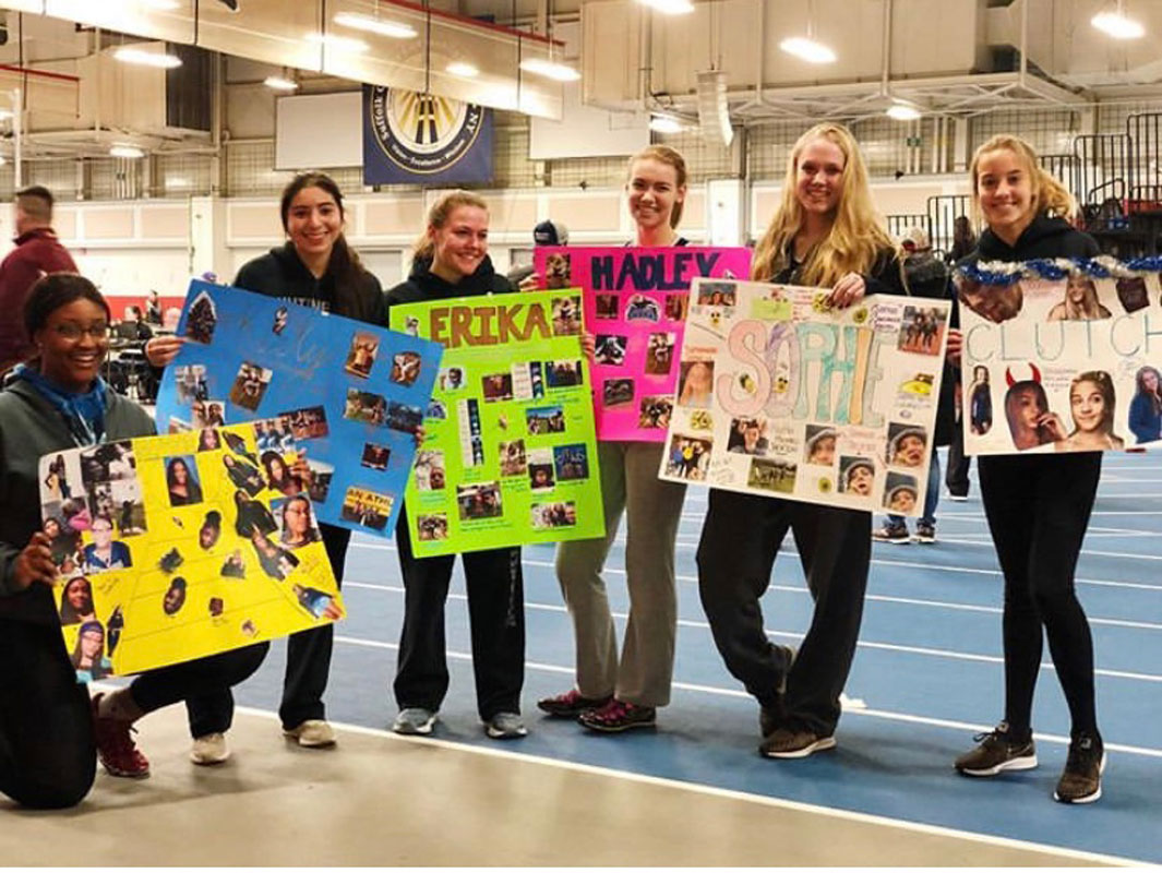 Colette Barron (right) at a Senior Day celebration with fellow Huntington girls' track seniors.