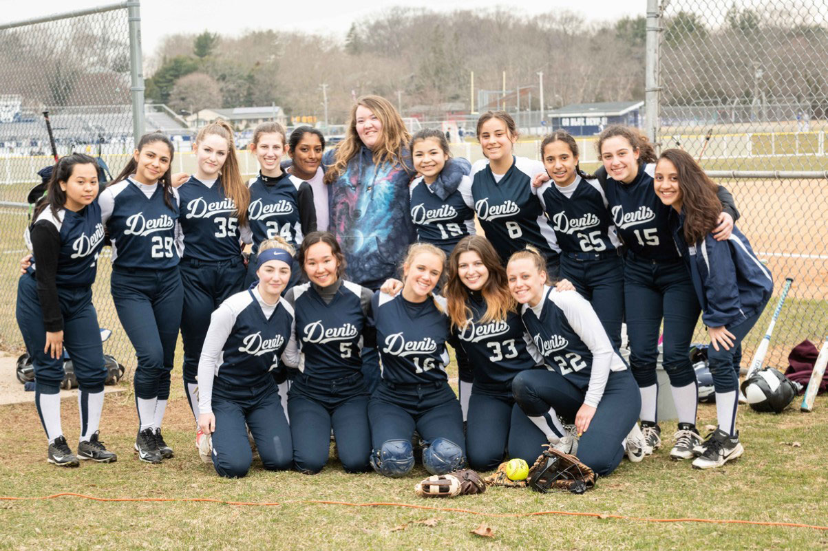 Daniela Ramos (standing at right) with the Huntington varsity softball team. (Darin Reed photo.)