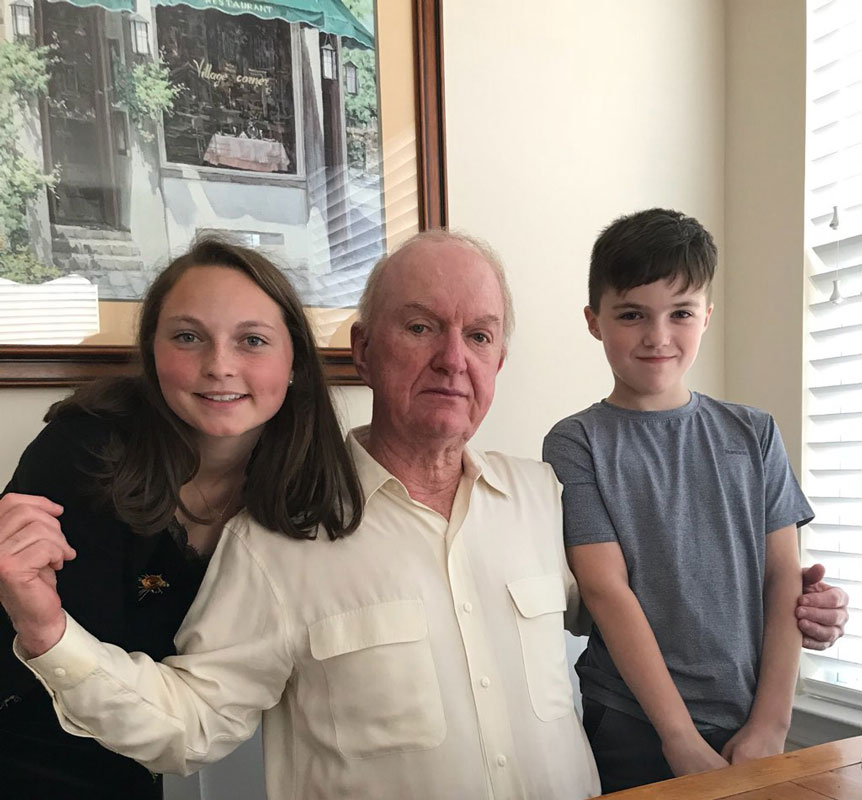Caroline Hartough and her brother, James flank their grandfather on his birthday.