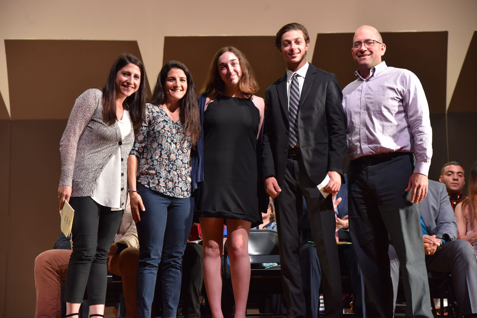 Isabella Cahill (center) and Joseph Garetano (second from right) with members of Brett Saltzman's family 