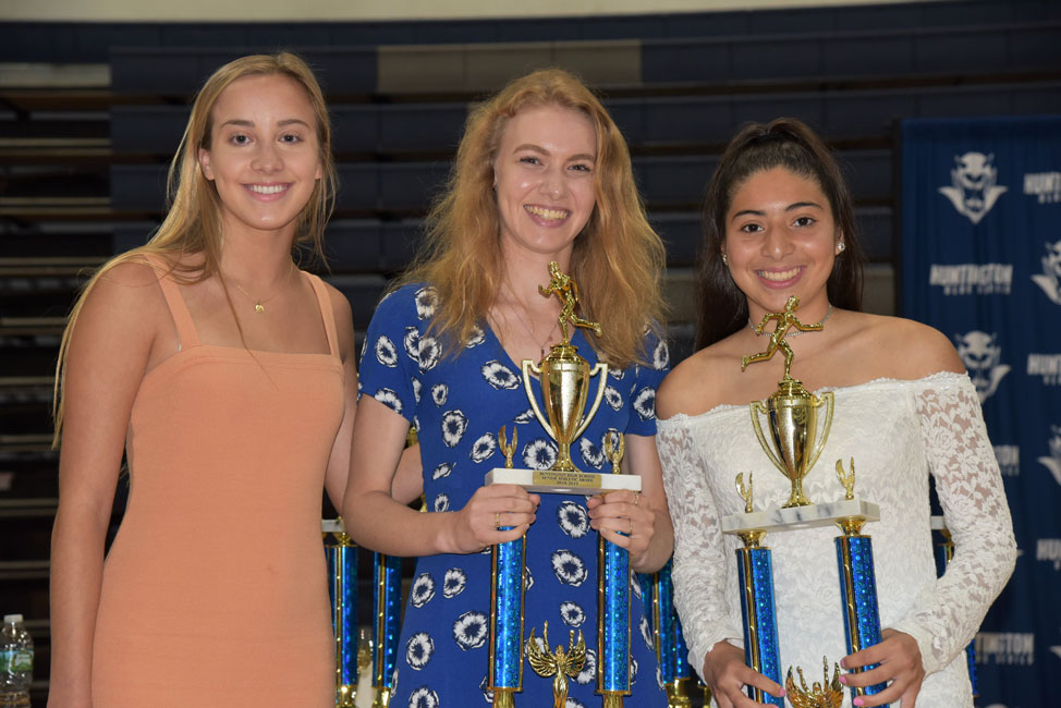 Huntington girls' cross country senior award recipients Colette Baron, Hadley Clayton and Keily Rivas 