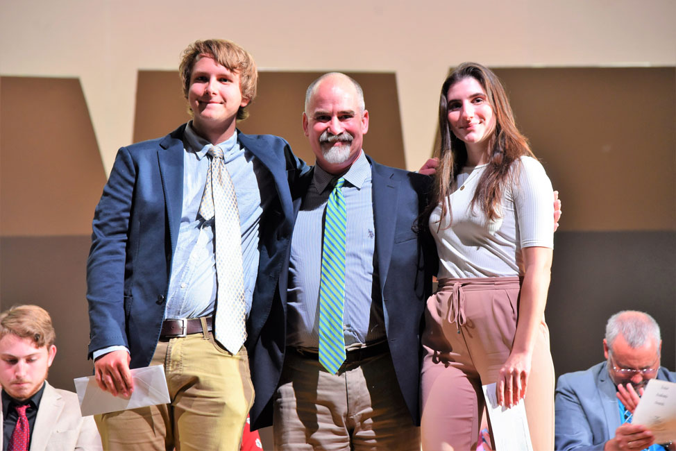 Huntington alum Christopher Williams presented the Alan Kuver Memorial Scholarship to Connor Dougal and Francesca Greco (1)