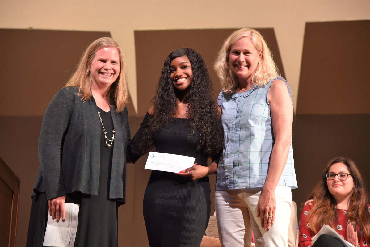 Kate Bender Memorial Scholarship Award recipient Mackenzie Joseph with Bender family members 