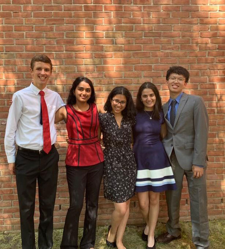 Diya Rai-Gersappe (center) with members of her researach project team at the Garcia Lab at Stony Brook University.