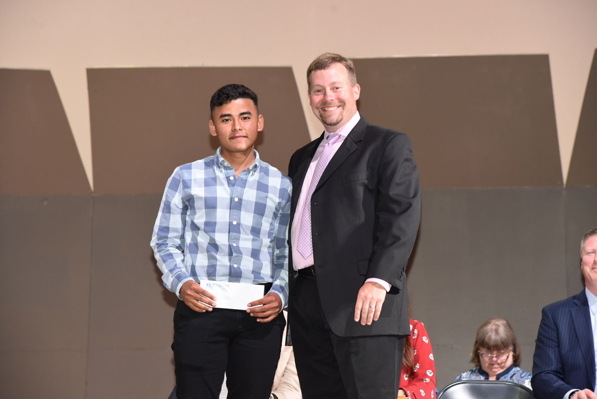 ATH President James Graber presented Edgar Rivas Lizama with a scholarship in memory of fallen teacher Alan Kuver 