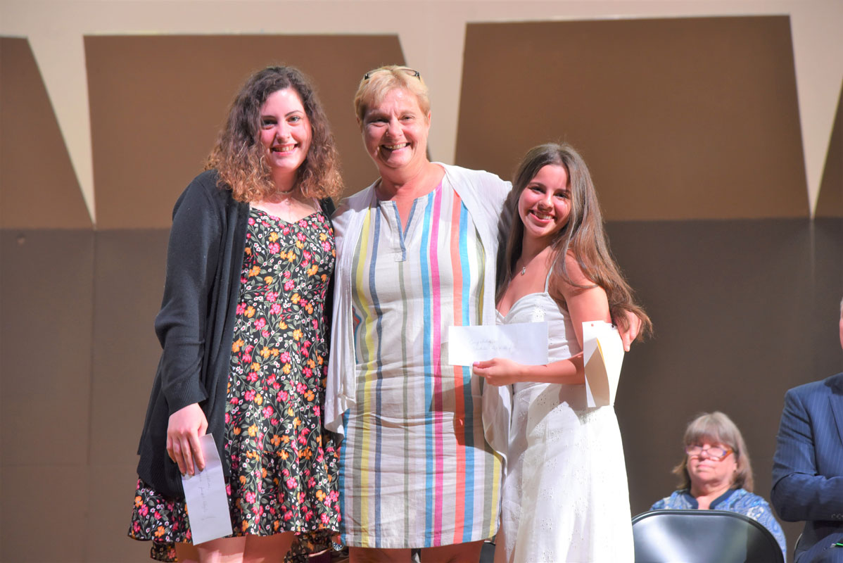 HARTE President Martha Ironman is flanked by scholarship recipients Julianna Joseph-Whyte and Yaidelis Acevedo 