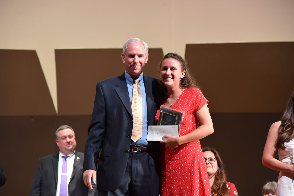 Jeraine Nieves-Morales with the Rotary Club's Bob Bishop 