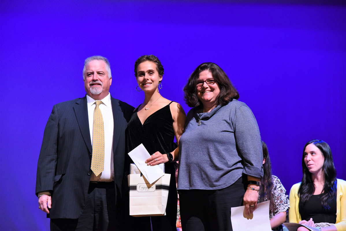 Glen and Anne Manaker flank Christina Nigro at last year's awards ceremony.