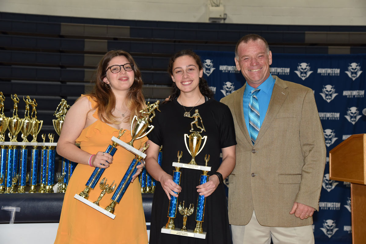 Huntington softball head coach John Walsh with senior award recipients Maya DelGiudice and Morgan Minicozzi 