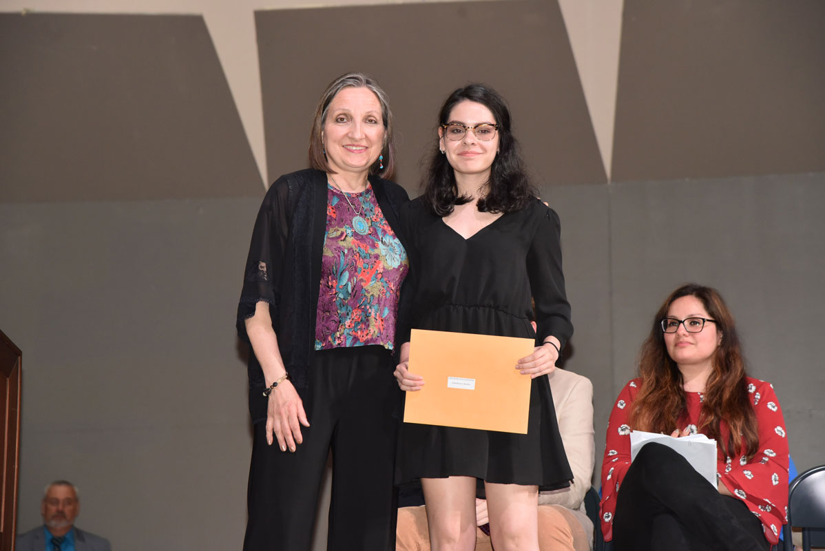 Teacher Kim Valerio with Outstanding Achievement in Drawing and Painting Award recipient Isabellarose Malone