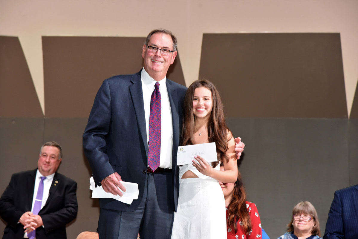 Yaidelis Acevedo with the Rotary Club's Bob Bishop 
