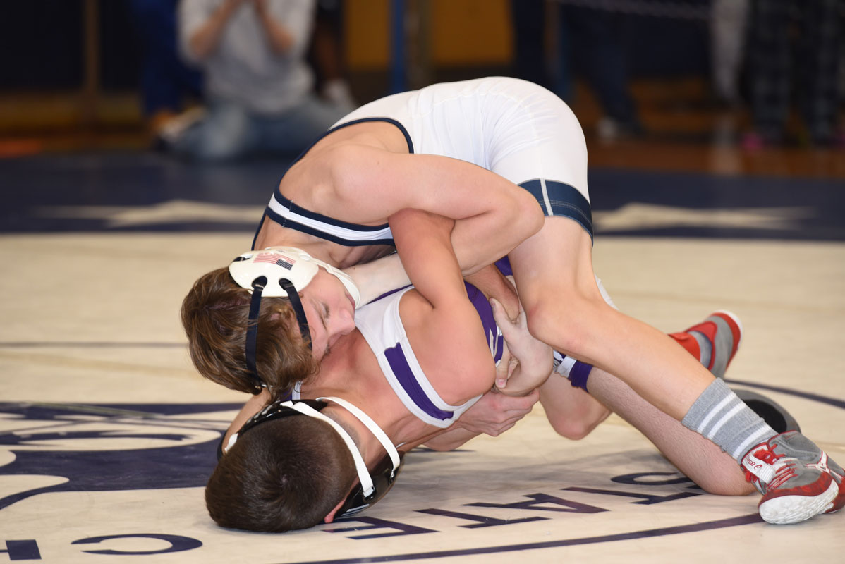 Lucas Cirlincione (top) works a bar arm in the finals last Saturday