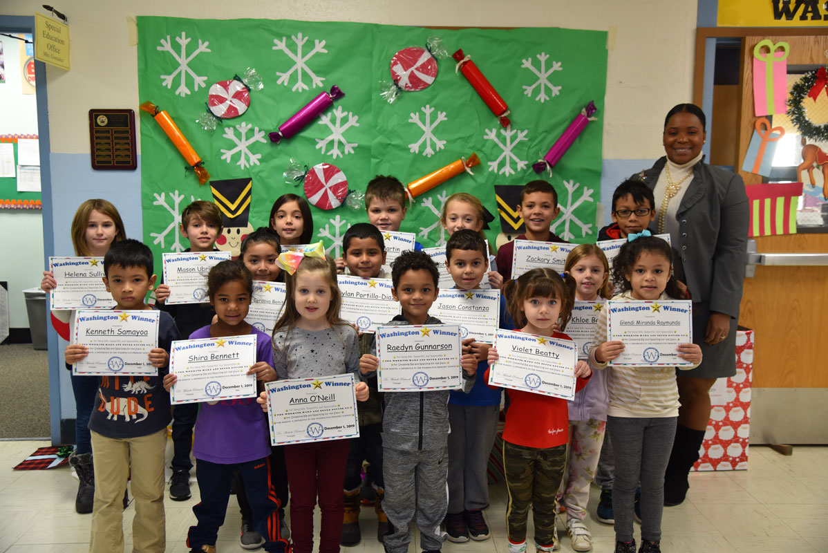 Principal Michelle Richards with recipients of November's Washington Way Awards 