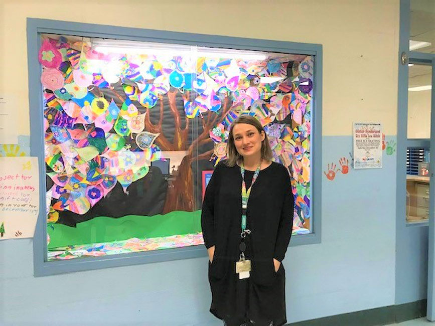 Art teacher Jackie Plesant near the Kindness Tree showcase at Flower Hill Primary School.