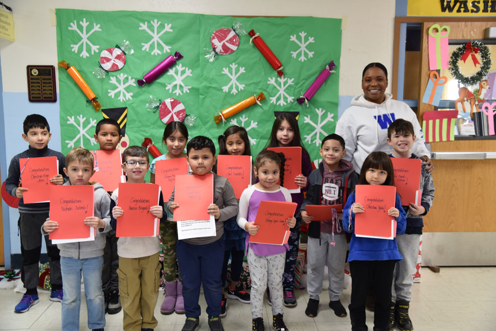 Principal Michelle Richards with Washington School's December Featured Artists of the Month 