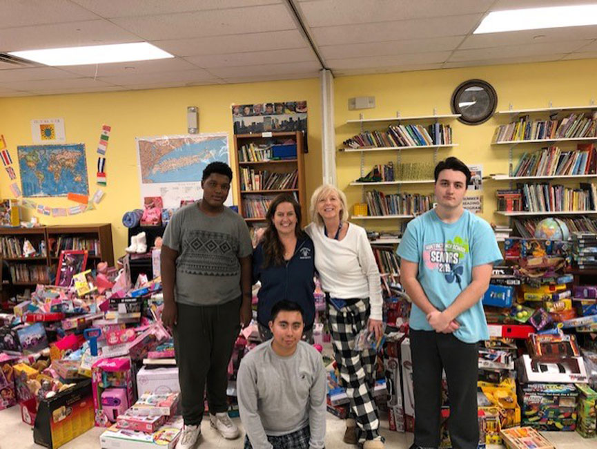 Huntington students helped sort and organize thousands of items donated to Project TOY.