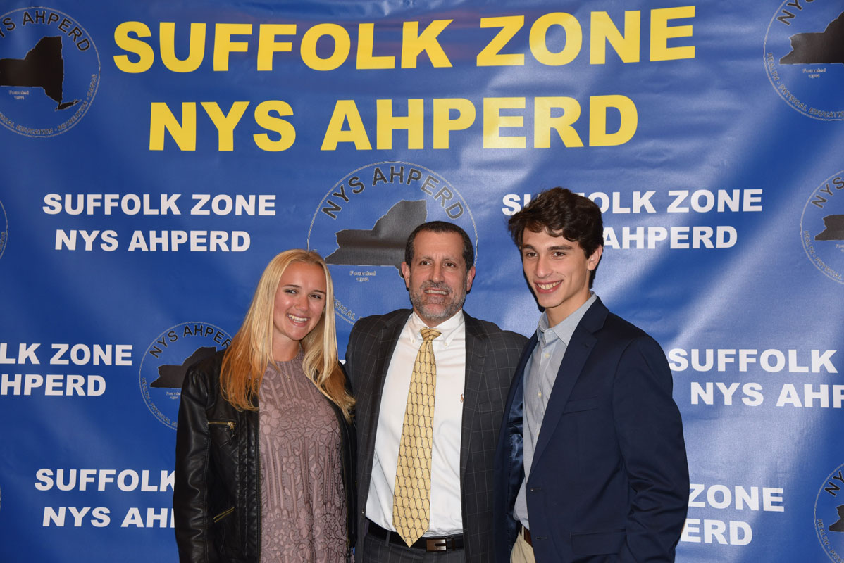 Huntington Superintendent James W. Polansky with Suffolk Zone Award recipients Alexandra Gerbavsits and Julien Rentsch