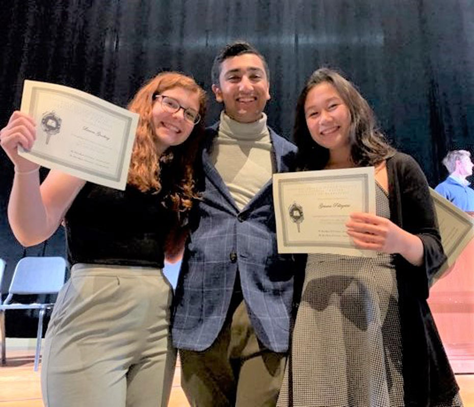 English Honor Society President Zubair Ali with a pair of new inductees.