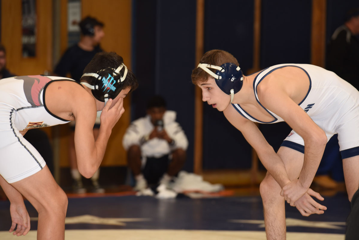 Huntington's Joe Petrone (right) was perfect en route to the 106 lb. title last Saturday.