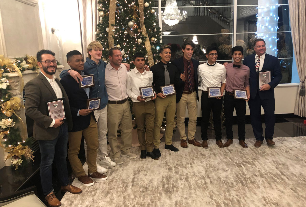 The Huntington boys' soccer team's award winning players and coaches at Villa Lombardi's.
