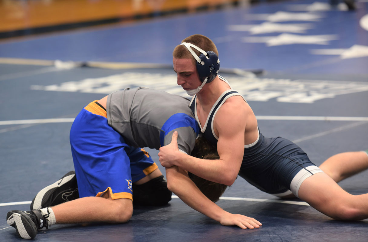 Blue Devil star Aedan McDonald (right) looks to score off a defensive maneuver last Saturday.