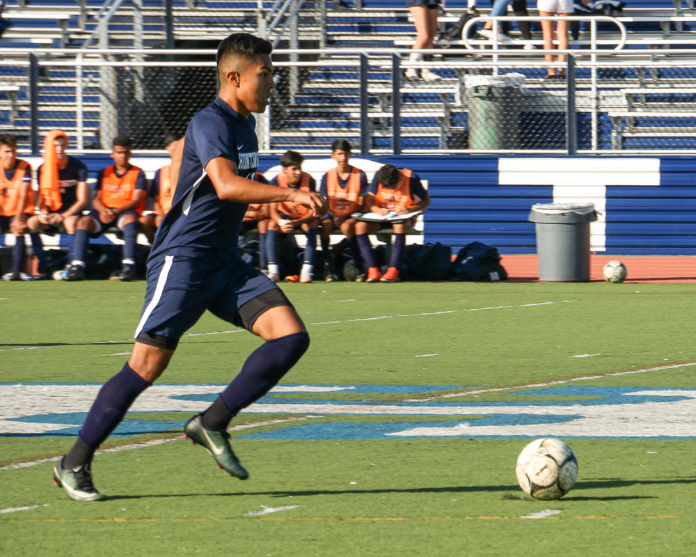 Senior Brian Contreras has the ball for Huntington.