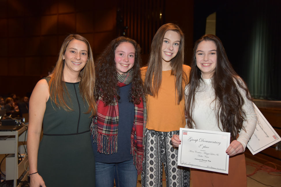 Moria Contino (right) with her research partners and teacher Lauren Desiderio at last year's National History Day awards night 