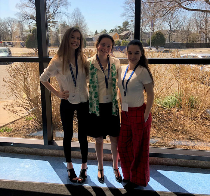 Maggie Lalor (center) with Isabella Neira and Moira Contino at the State History Day regionals at Hofstra.
